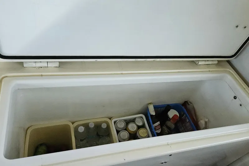 Slide: The Image of Open cooler with drinks and condiments inside a 1989 Breaux Brothers Sportfisherman. - 18