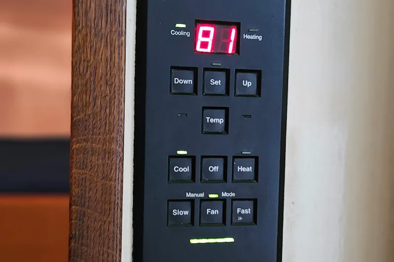 Slide: The Image of Control panel of a 1989 Breaux Brothers Sportfisherman, displaying temperature settings and buttons. - 26