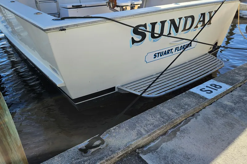 Slide: The Image of 1989 Breaux Brothers 42 Sportfisherman docked in Stuart, Florida, with "Sunday" on the stern. - 3