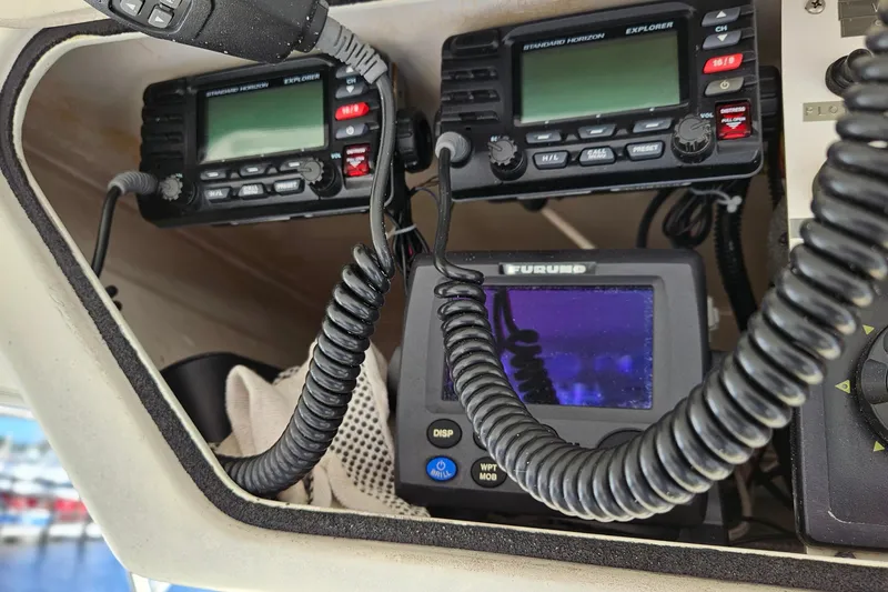 Slide: The Image of 1989 Breaux Brothers Sportfisherman boat electronics, featuring communication and navigation devices. - 35