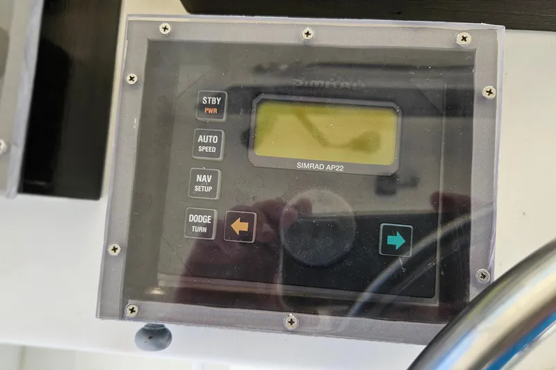 Slide: The Image of Simrad AP22 autopilot control panel on 1989 Breaux Brothers Sportfisherman boat. - 37