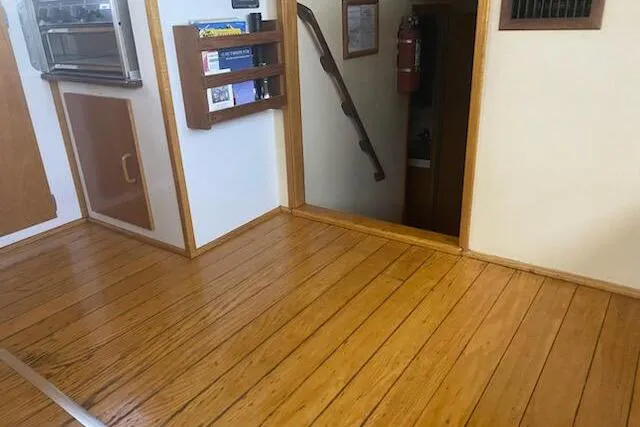 Slide: The Image of Interior of 1989 Breaux Brothers 42 Sportfisherman with wooden flooring and storage shelves. - 9