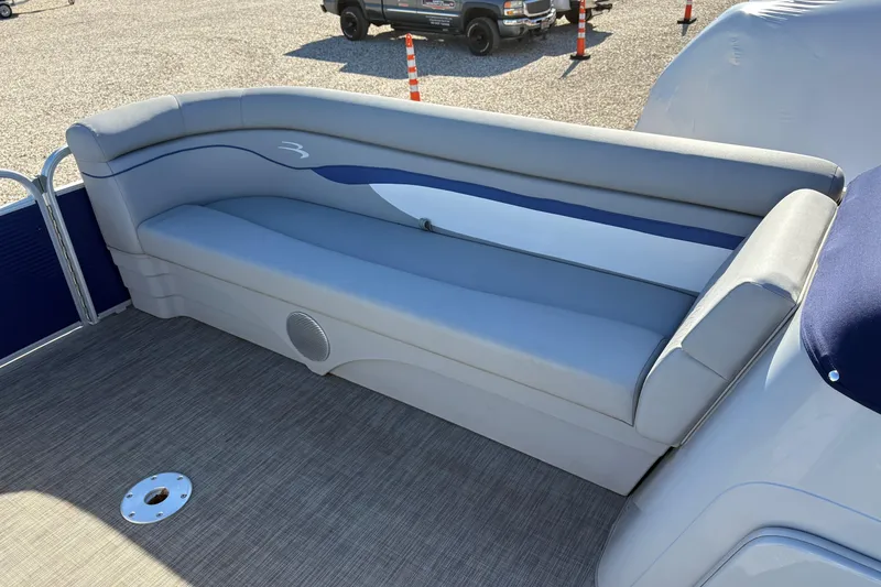 Slide: The Image of 2021 Bennington 24 SVRC boat interior with gray seating and cup holders. - 12
