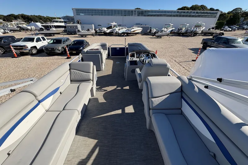 Slide: The Image of 2021 Bennington 24 SVRC pontoon boat on trailer in outdoor storage area. - 3