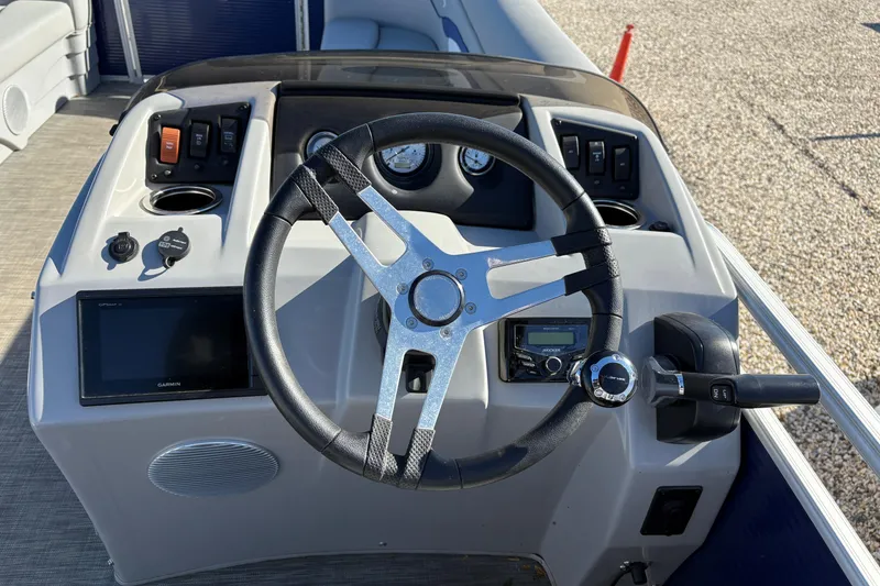 Slide: The Image of Open storage compartments on a 2021 Bennington 24 SVRC boat seat. - 7