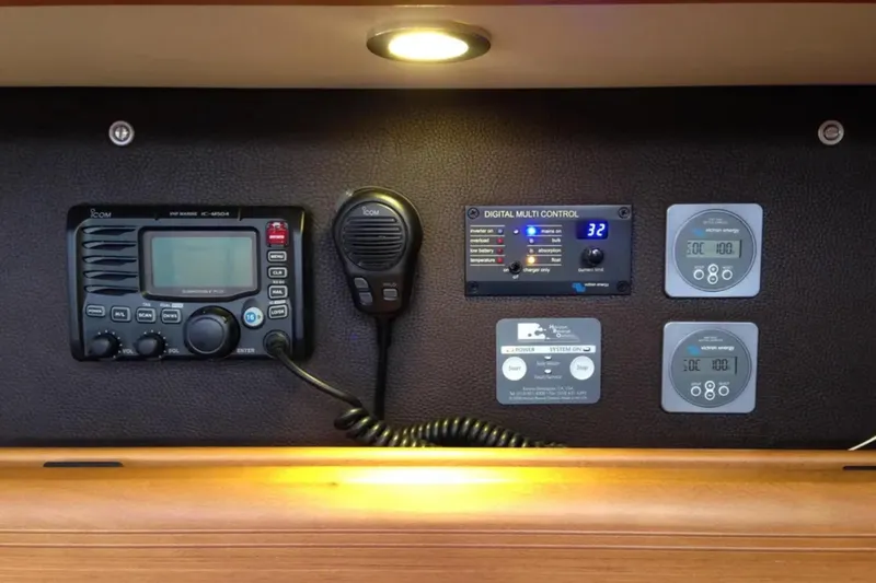 Slide: The Image of Control panel of a 2011 Jeanneau 57 yacht with radio and digital displays. - 30