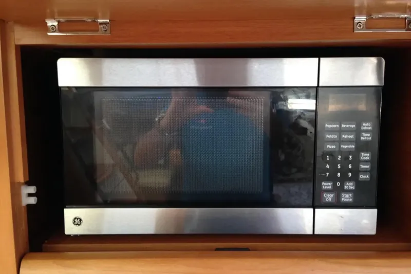 Slide: The Image of Built-in GE microwave in 2011 Jeanneau 57 yacht kitchen. - 33