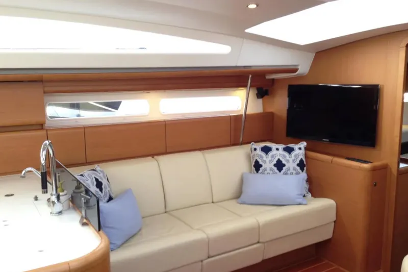Slide: The Image of Luxurious interior of 2011 Jeanneau 57 yacht with modern seating and TV. - 35