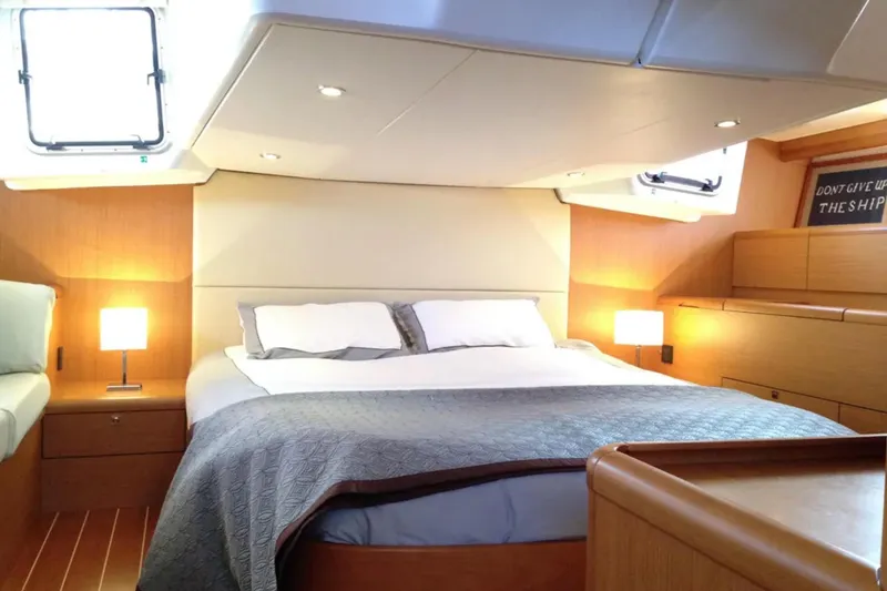 Slide: The Image of Luxurious cabin interior of 2011 Jeanneau 57 yacht with cozy bed and ambient lighting. - 46