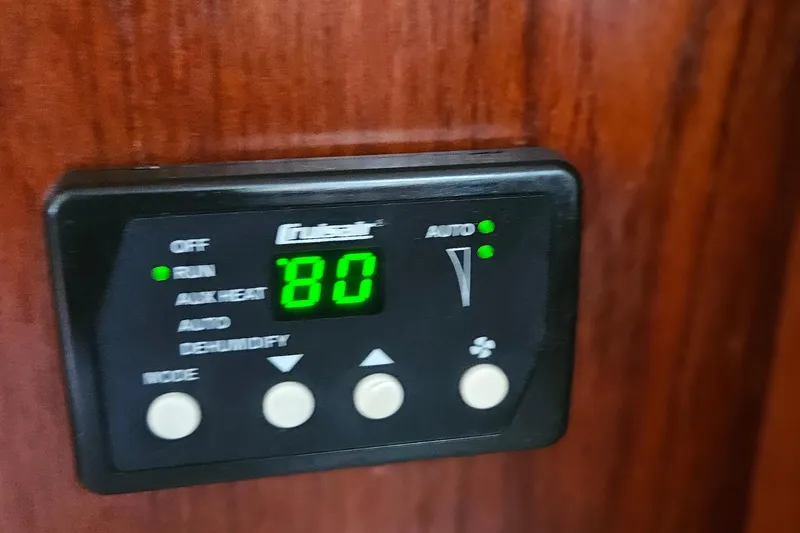 Slide: The Image of Digital control panel on a 1977 Peterson 34 Sloop, displaying temperature settings. - 18
