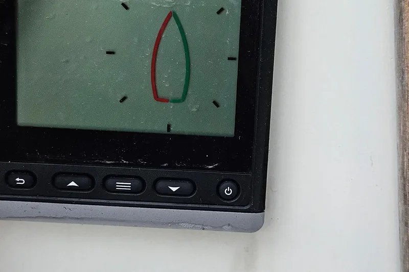 Slide: The Image of Close-up of a 1977 Peterson 34 Sloop navigation display with control buttons. - 30