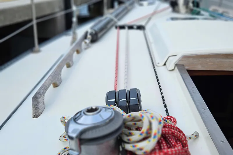 Slide: The Image of Close-up of 1977 Peterson 34 Sloop deck with winch and colorful ropes. - 35