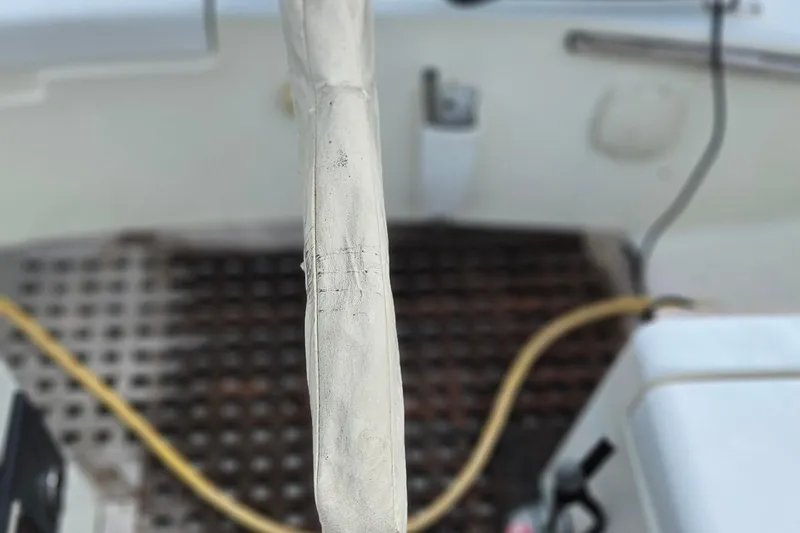 Slide: The Image of Cockpit view of a 1977 Peterson 34 Sloop sailboat, featuring deck details. - 37