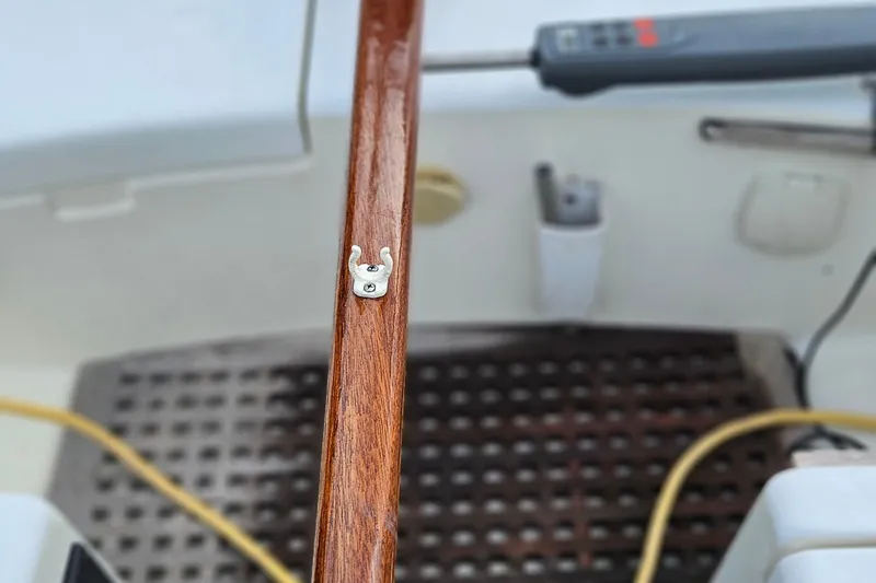 Slide: The Image of 1977 Peterson 34 Sloop cockpit with wooden tiller and nautical equipment. - 41