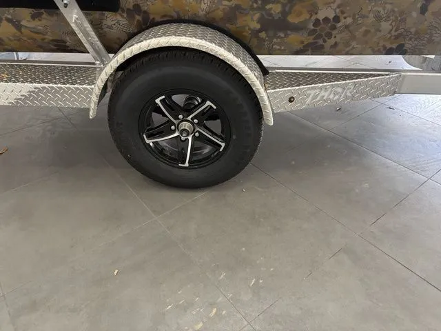 Slide: The Image of Thor 1754 Timber Hammer 2026 outboard motor on boat trailer. - 20