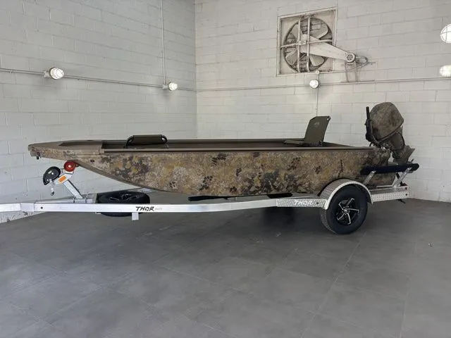 Slide: The Image of 2026 Thor Boats 1754 Timber Hammer Elite with camouflage design on trailer. - 3