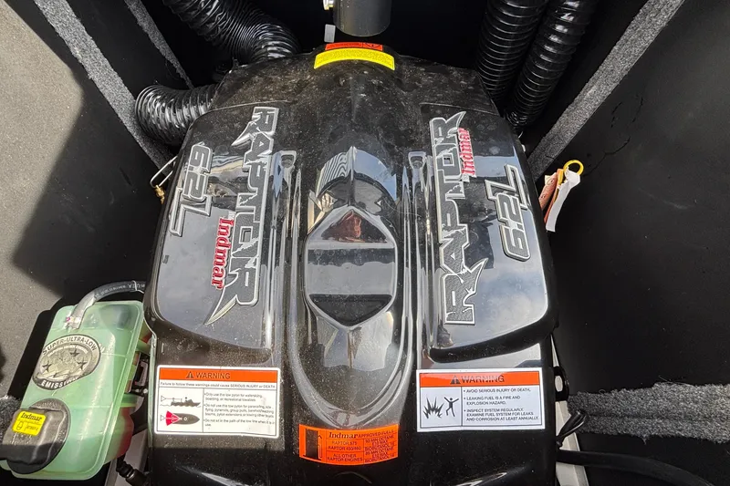 Slide: The Image of 2019 Supra SL 450 engine, Raptor Indmar 6.2L, with warning labels visible. - 12