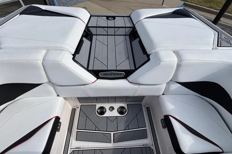 Slide: The Image of 2019 Supra SL 450 boat interior with white seating and sleek design. - 13