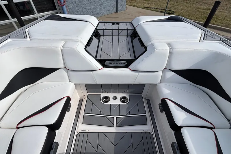 Slide: The Image of 2019 Supra SL 450 boat interior with white and black seating, modern design. - 14