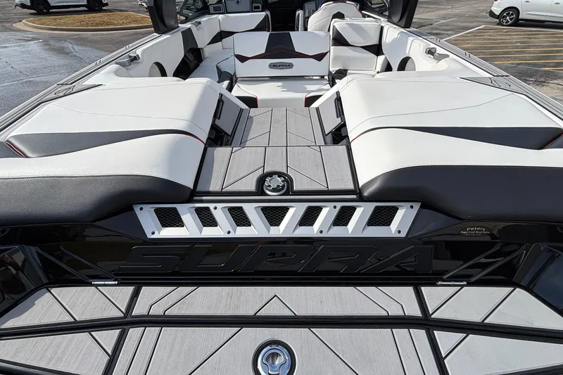 Slide: The Image of 2019 Supra SL 450 boat interior with sleek seating and modern design. - 18