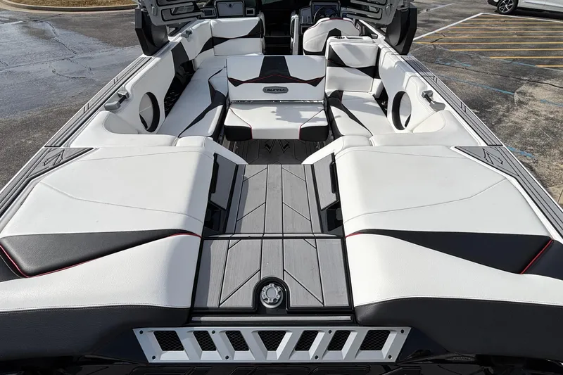 Slide: The Image of 2019 Supra SL 450 boat interior with white and black seating, modern design. - 19
