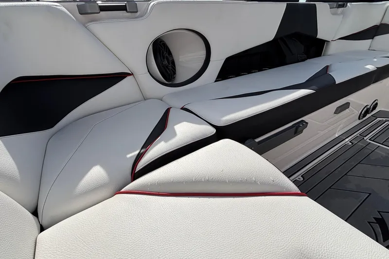 Slide: The Image of Luxurious interior of 2019 Supra SL 450 boat with white leather seating and speaker. - 24