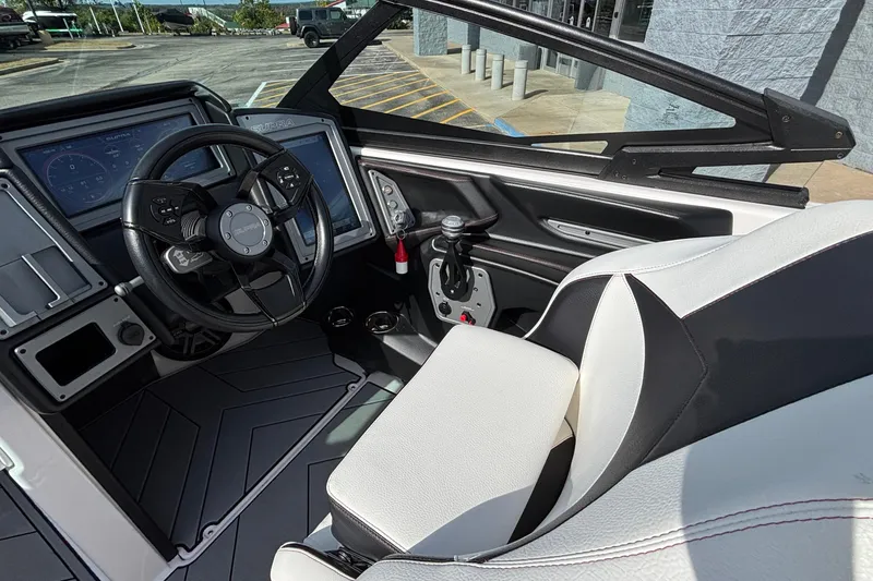 Slide: The Image of 2019 Supra SL 450 boat interior with steering wheel and dashboard controls. - 27