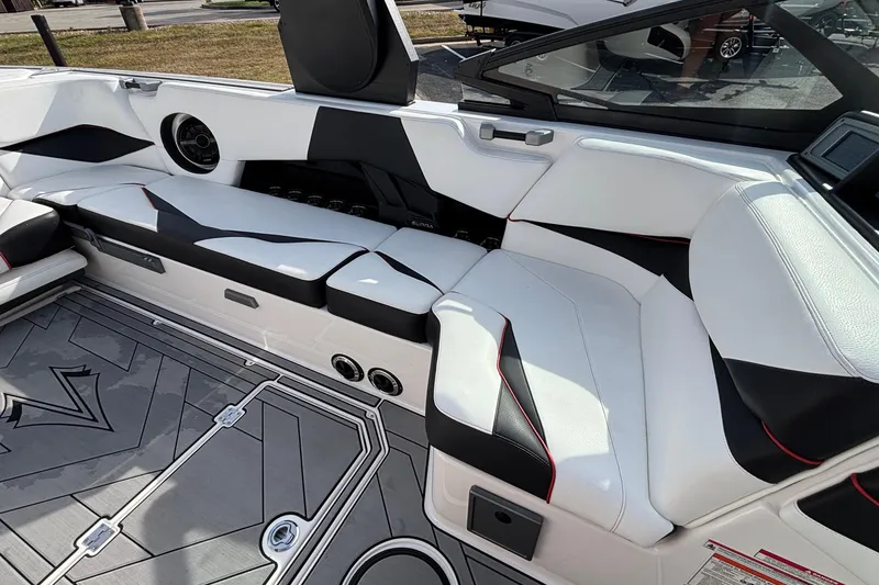 Slide: The Image of 2019 Supra SL 450 boat interior with sleek white and black seating design. - 33