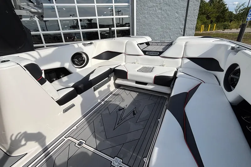 Slide: The Image of 2019 Supra SL 450 boat interior with white and black seating, modern design. - 36