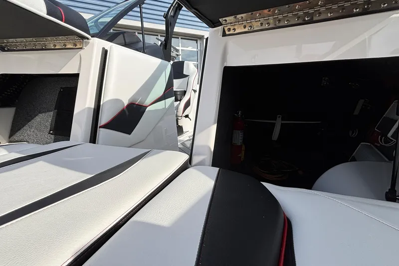 Slide: The Image of Interior of 2019 Supra SL 450 boat with white and black seating. - 40