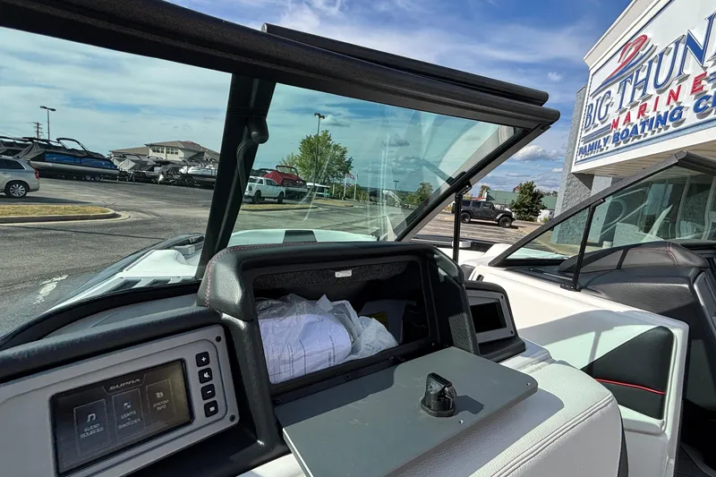Slide: The Image of 2019 Supra SL 450 boat interior with open storage compartment at Big Thunder Marine. - 44