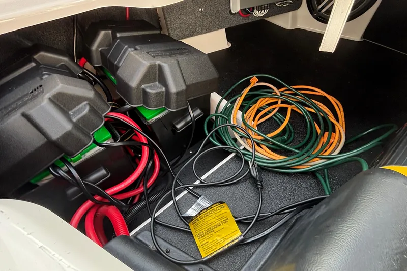 Slide: The Image of 2019 Supra SL 450 battery compartment with cables and wiring. - 45