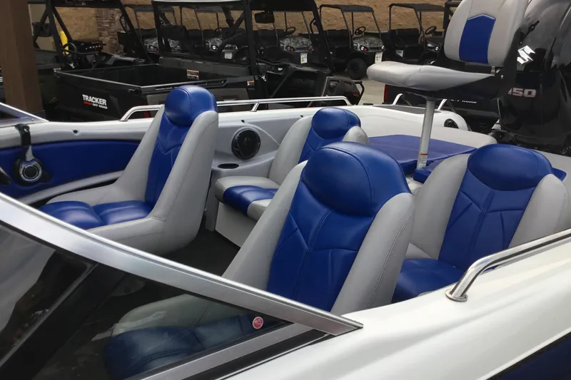 Slide: The Image of 2011 Skeeter SL190 boat interior with blue and white seating, showcasing modern design. - 6