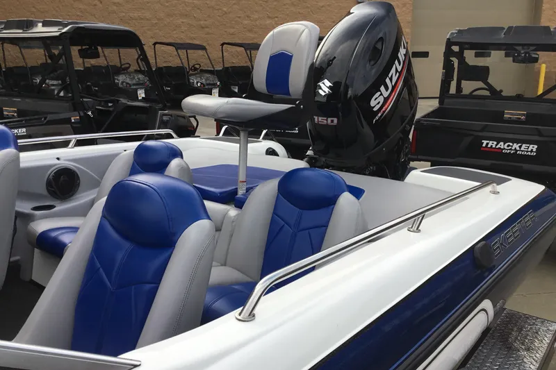 Slide: The Image of 2011 Skeeter SL190 boat with blue seats and Suzuki 150 outboard motor. - 7