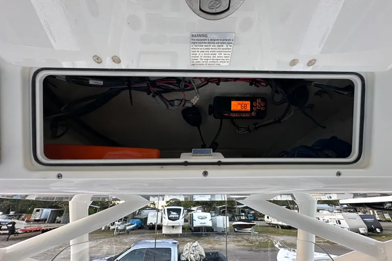 Slide: The Image of 2022 Sea Fox 228 Commander electronics compartment with visible wiring and control panel. - 28