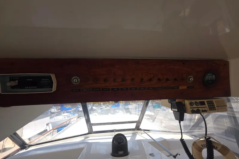 Slide: The Image of 1979 Trojan 44 Motor Yacht dashboard with navigational controls and instruments. - 17