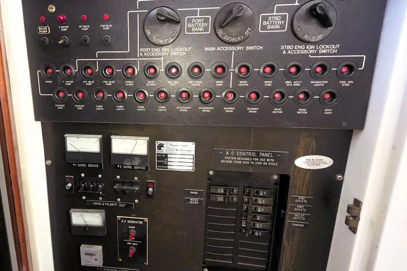 Slide: The Image of Control panel of a 1979 Trojan 44 Motor Yacht with switches and gauges. - 20