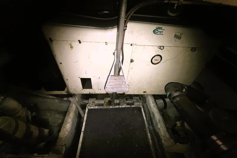Slide: The Image of Engine room of a 1979 Trojan 44 Motor Yacht with visible machinery components. - 30