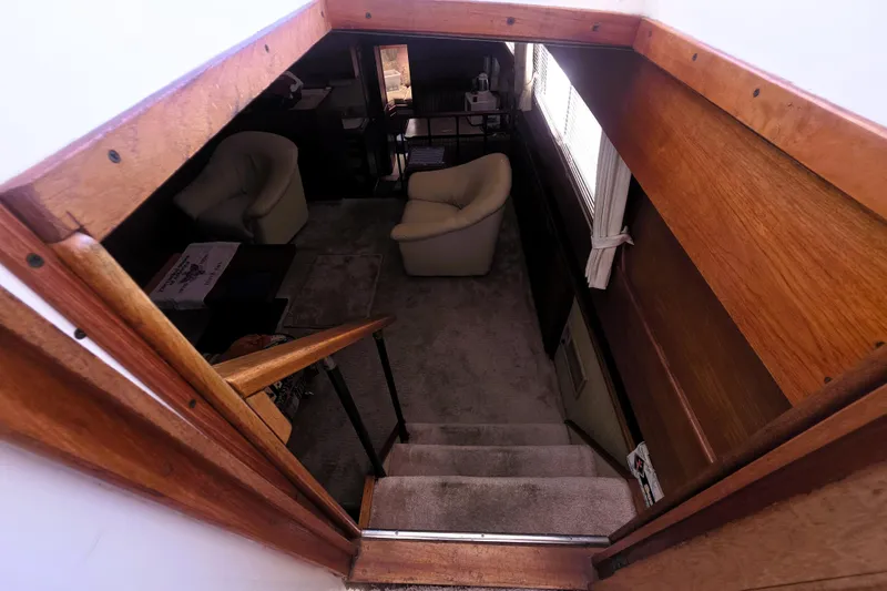 Slide: The Image of Interior view of 1979 Trojan 44 Motor Yacht with cozy seating area. - 6