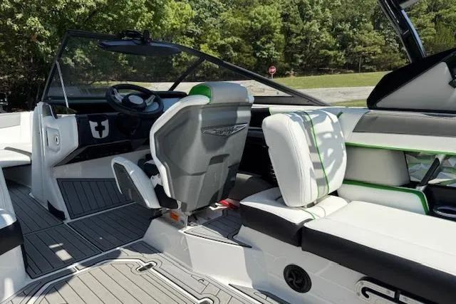 Slide: The Image of 2017 Nautique Super Air Nautique G23 interior with sleek seating and modern dashboard design. - 12