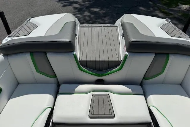 Slide: The Image of 2017 Nautique Super Air Nautique G23 boat interior with gray and green accents. - 13
