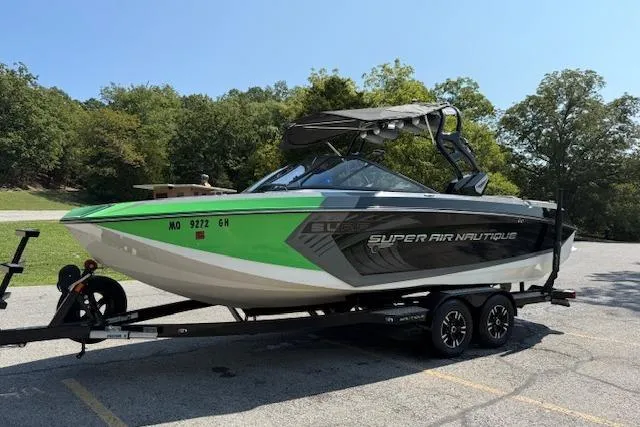 Slide: The Image of 2017 Nautique Super Air Nautique G23 boat on trailer in a parking lot. - 4
