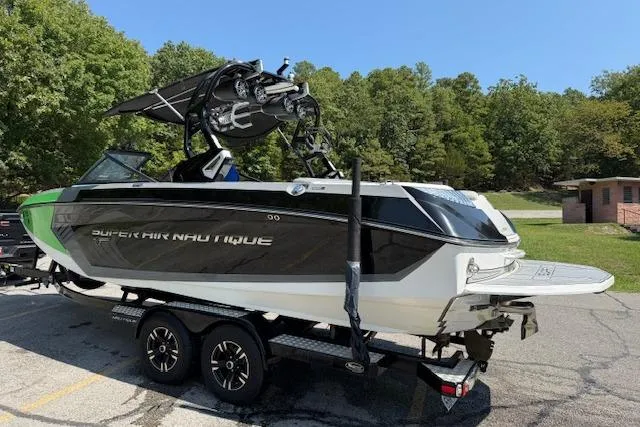 Slide: The Image of 2017 Nautique Super Air Nautique G23 boat on trailer, parked outdoors. - 6