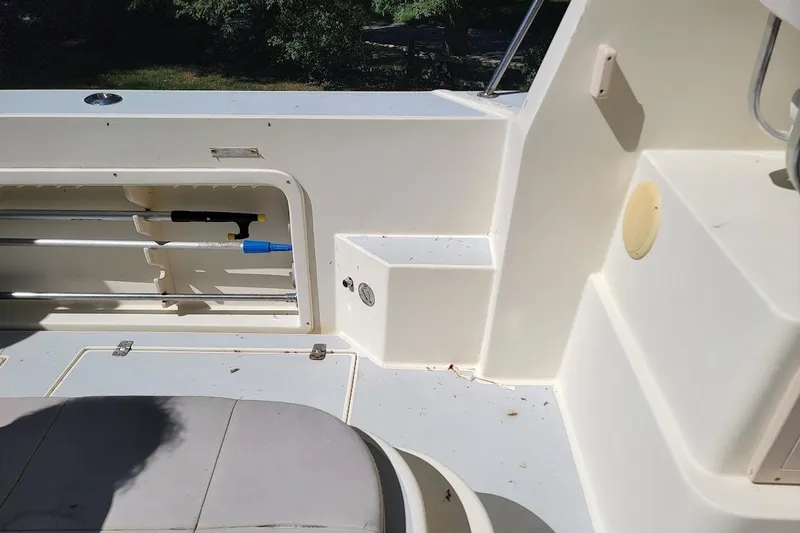 Slide: The Image of Interior view of a 1997 Albin 28 Tournament Express boat, featuring storage compartments. - 11