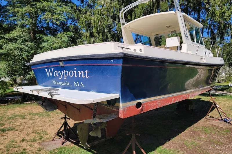 Slide: The Image of 1997 Albin 28 Tournament Express boat named "Waypoint" in Waquoit, MA, on stands. - 5