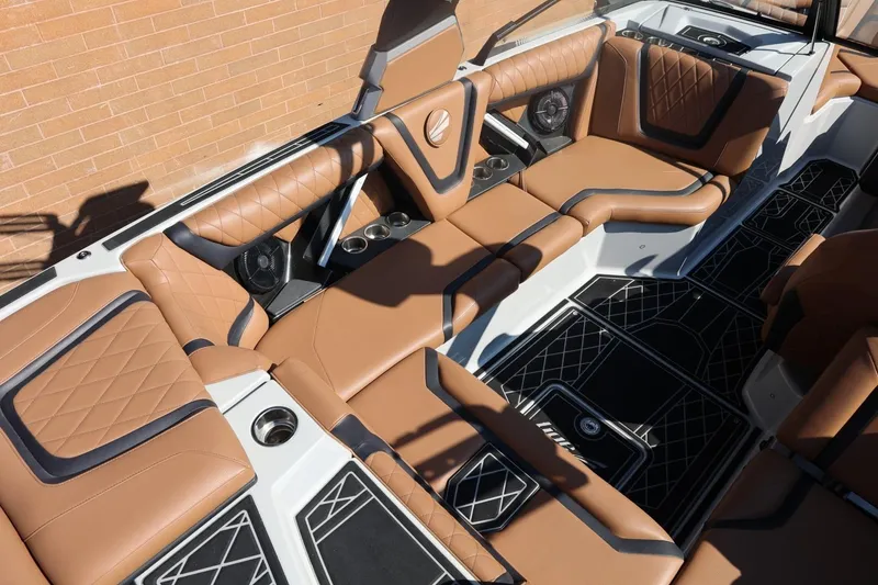 Slide: The Image of Luxurious interior of 2021 Tigé 21ZX boat with tan leather seating and modern design. - 12