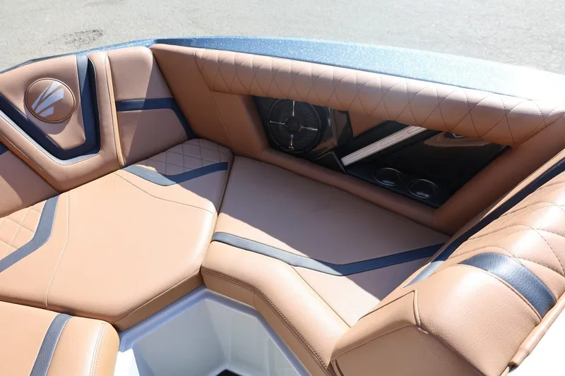 Slide: The Image of Luxurious interior of 2021 Tigé 21ZX boat with tan leather seating. - 18