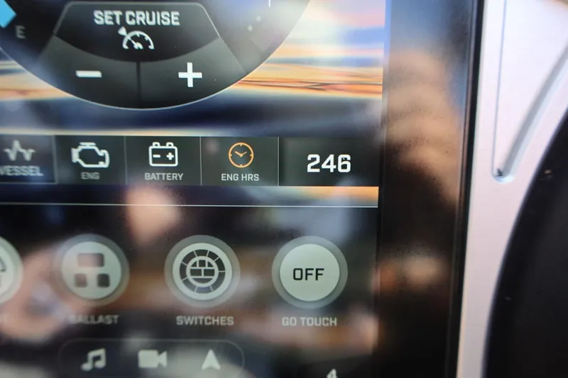 Slide: The Image of 2021 Tigé 21ZX dashboard display showing engine hours and controls. - 29
