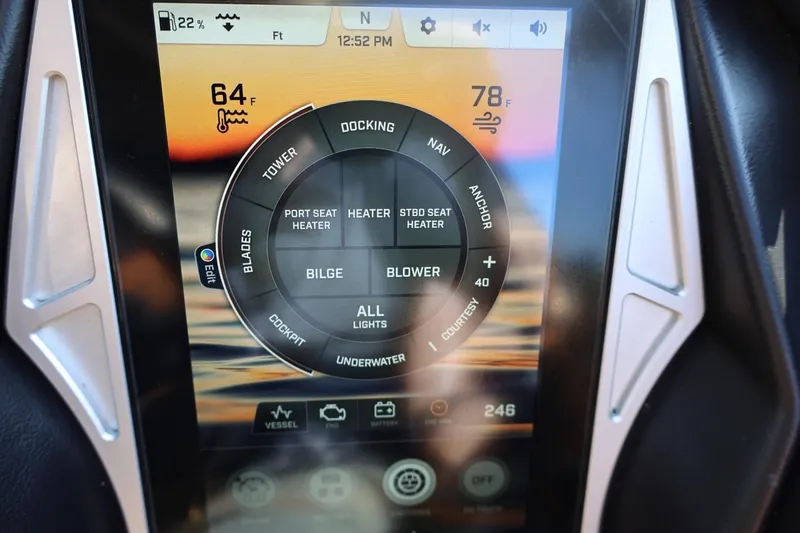 Slide: The Image of Touchscreen control panel of a 2021 Tigé 21ZX boat displaying temperature and settings. - 32