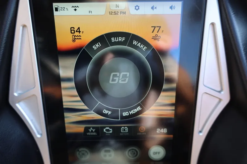 Slide: The Image of Touchscreen display of a 2021 Tigé 21ZX boat showing ski, surf, and wake options. - 33